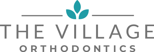 The logo for The Village Orthodontics